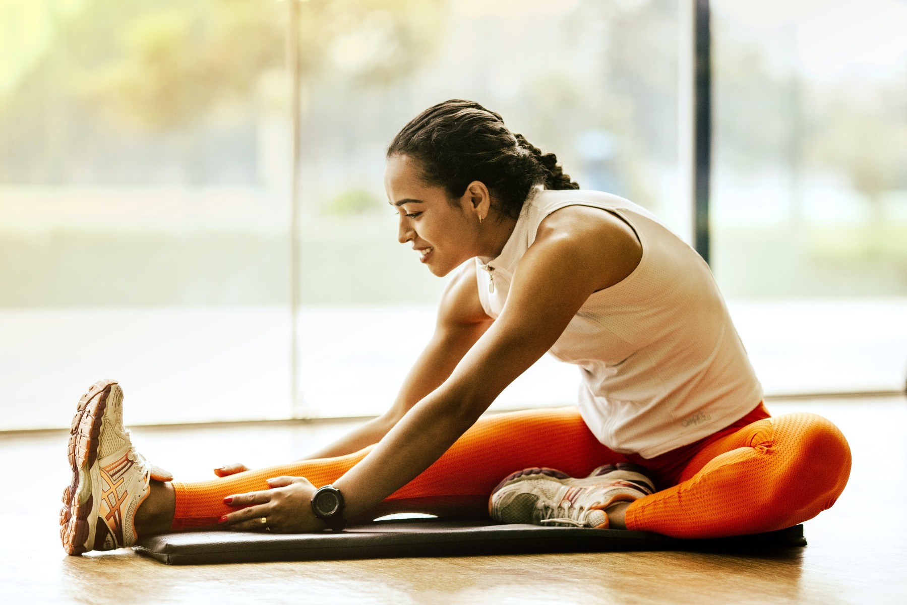 Types of Exercise: Woman doing deep stretches