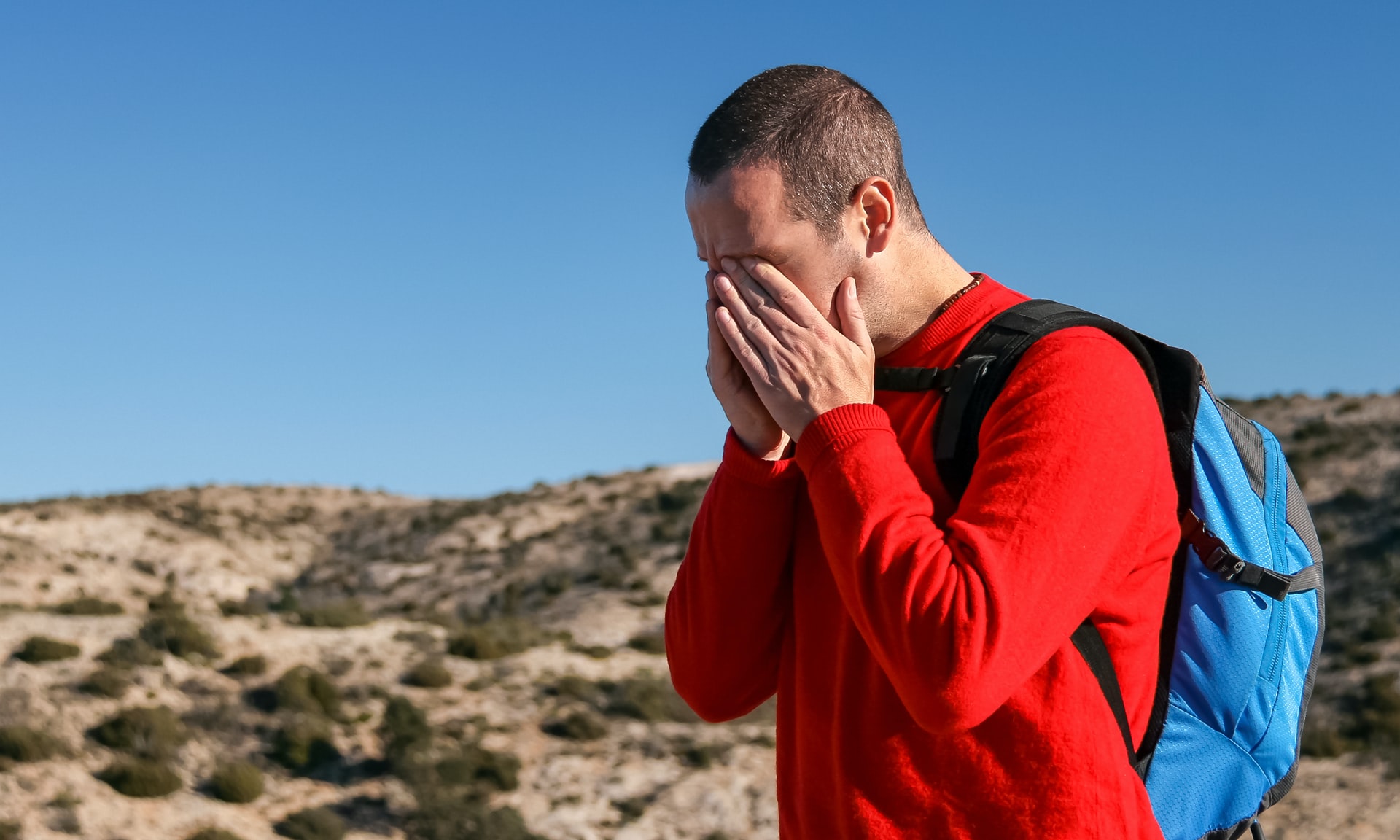 Man rubbing his eyes